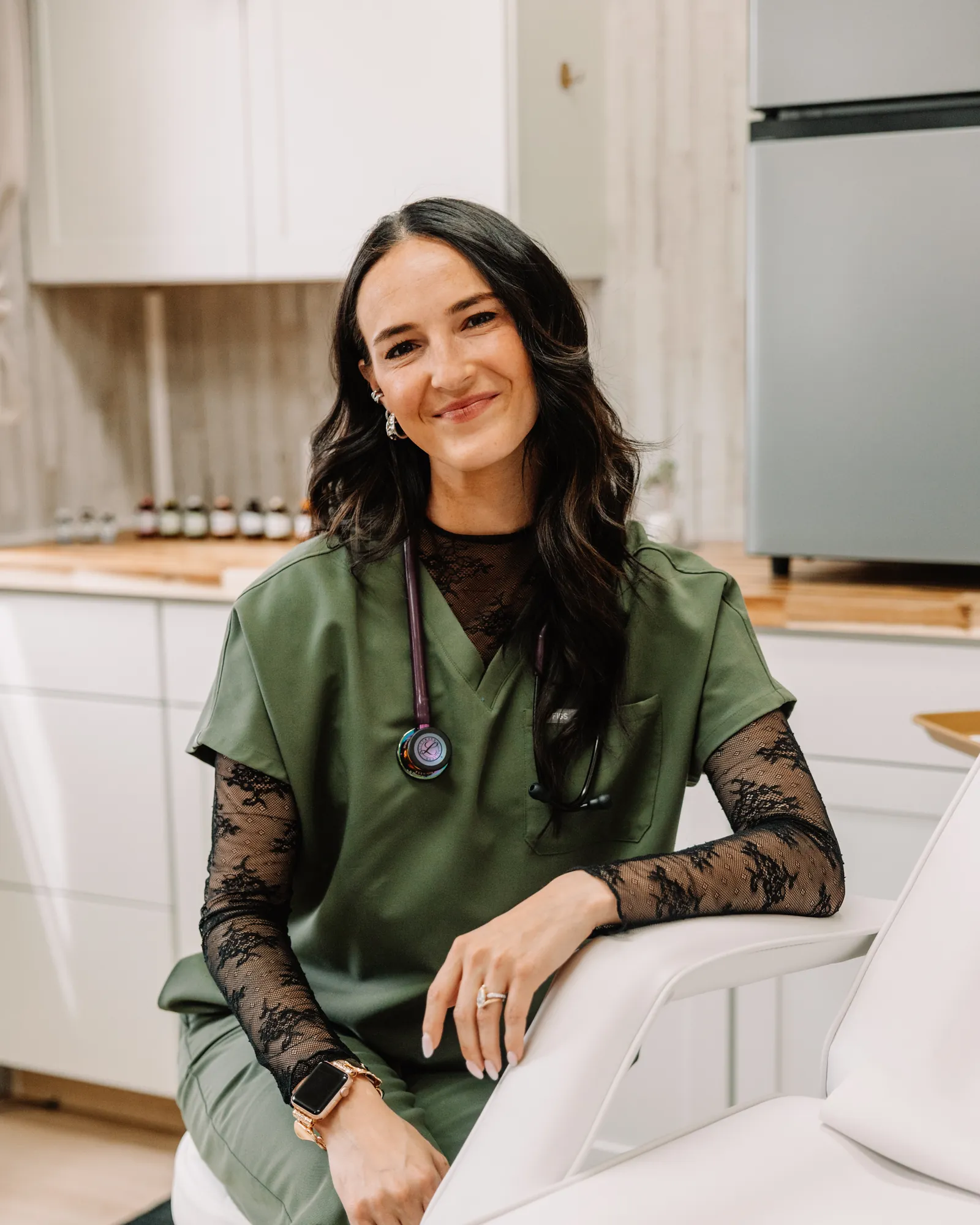 Jaedee — owner and provider, Jaed Aesthetics — seated in the studio