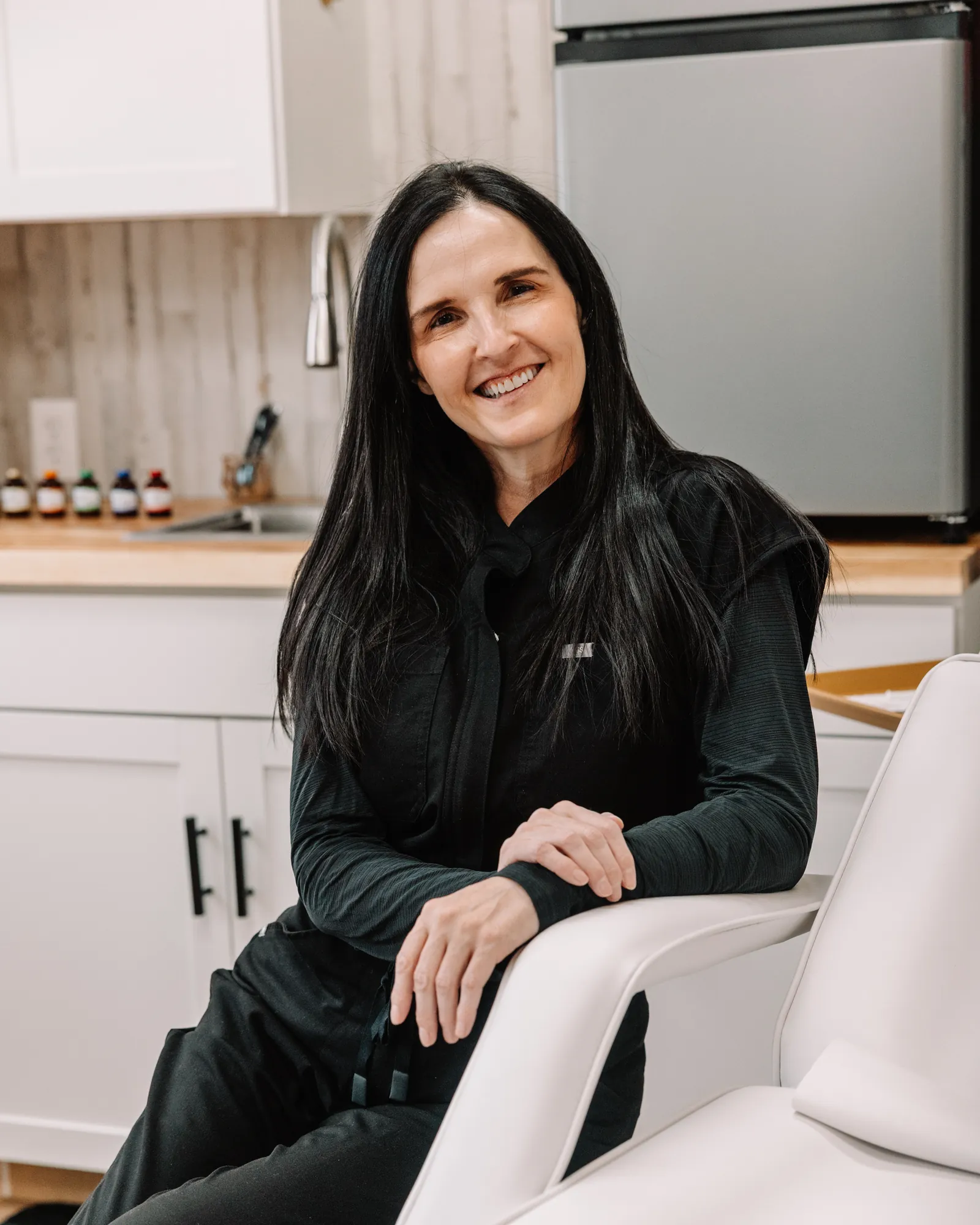 Melissa — Nurse Practitioner and supervising provider, Jaed Aesthetics — seated in the studio