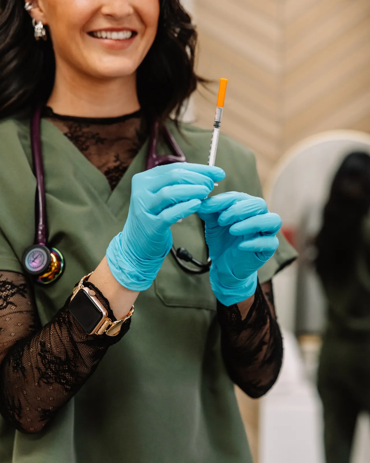 Jaedee preparing a syringe in the Jaed Aesthetics studio