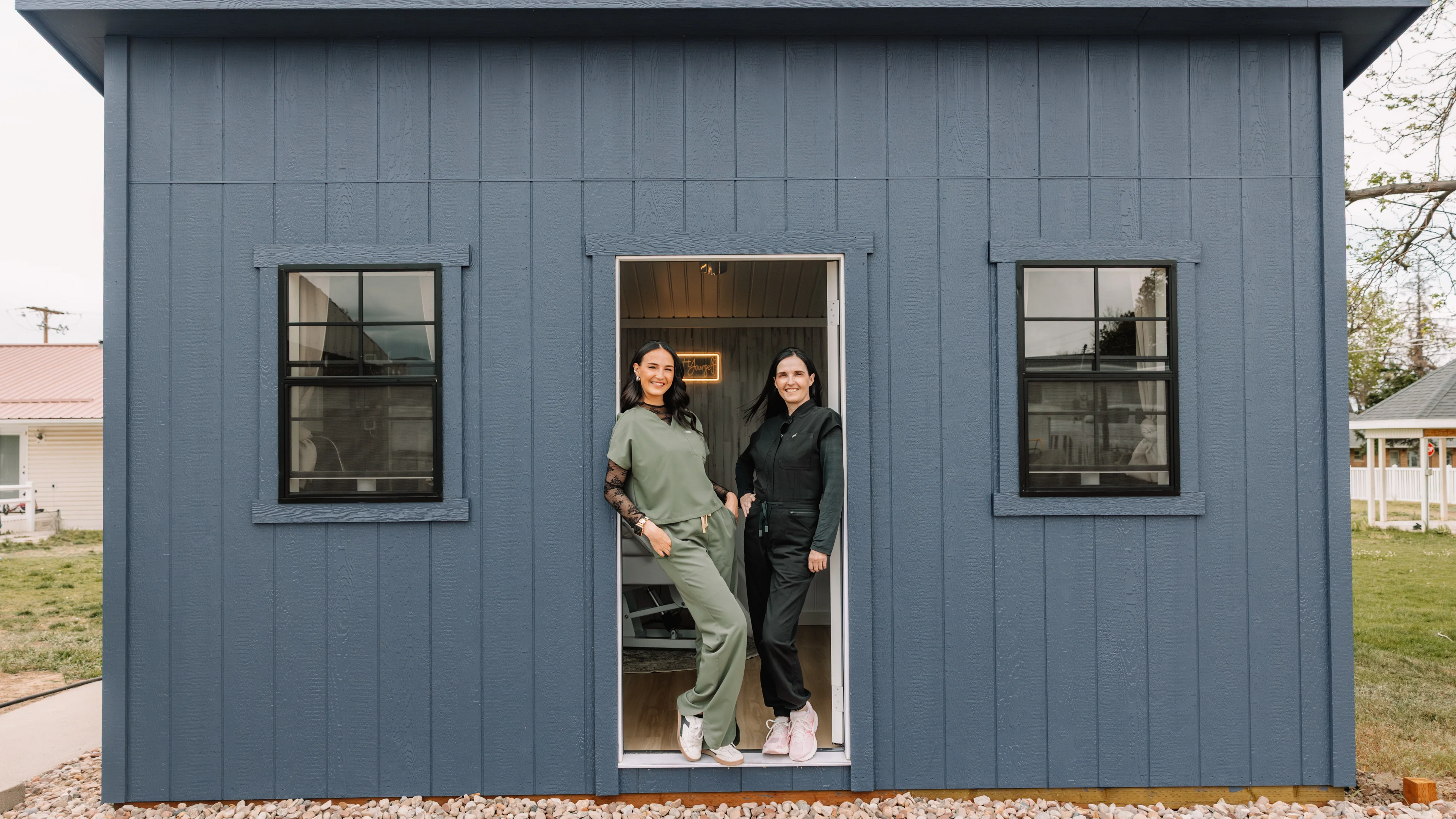 The Jaed Aesthetics studio in Vernal, Utah — Jaedee and Melissa standing in the doorway